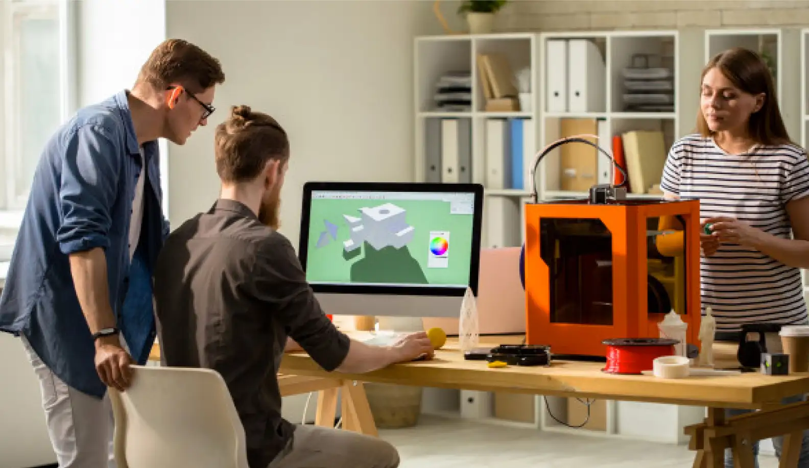 image of an artist designing a 3D mark using a computer