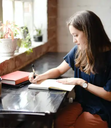 image of an author writing a piece of content protected by copyright laws in united arab emirates