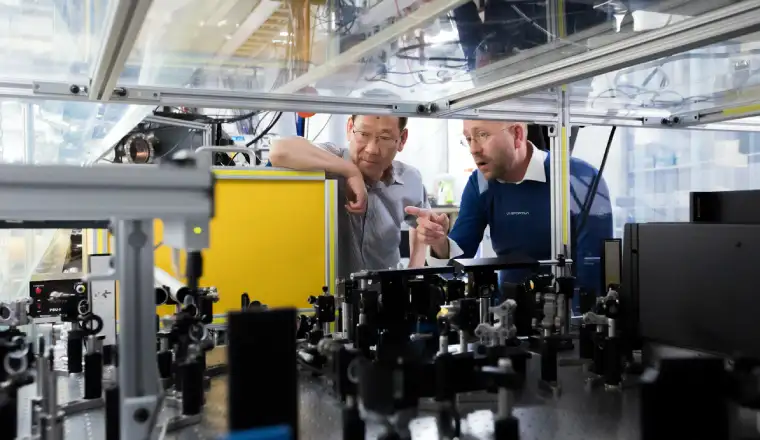 image of 2 engineers discussing on how to bring benefits to brand