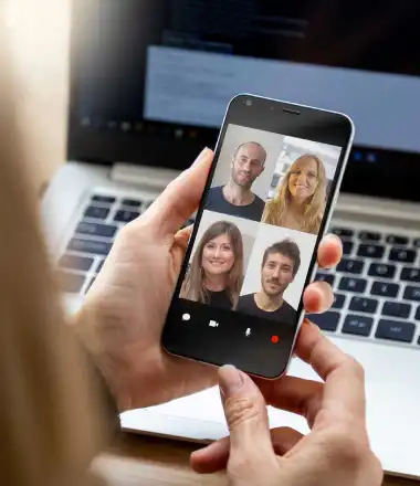 young entrepreneur doing a video conference in phone application