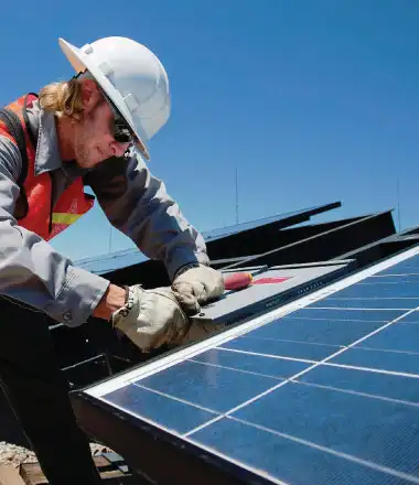 man renovating the roof an eco friendly building