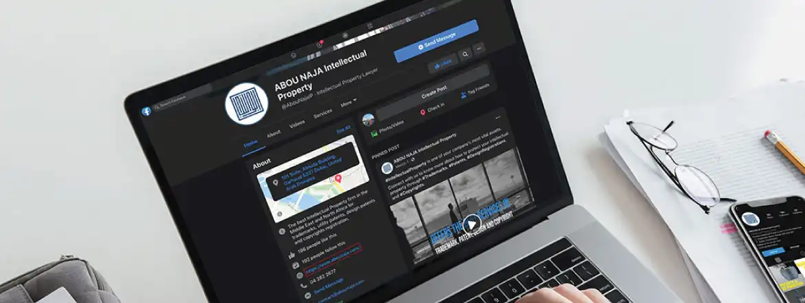 laptop and Smartphone showing the social media platform Facebook of Abounaja