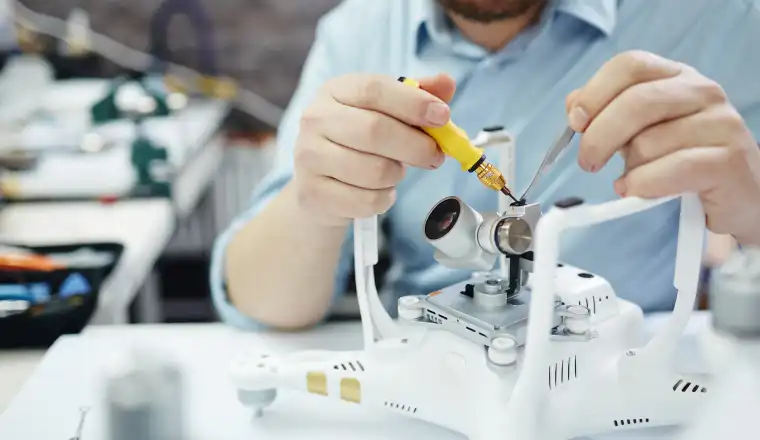 an engineer trying to repair a machine
