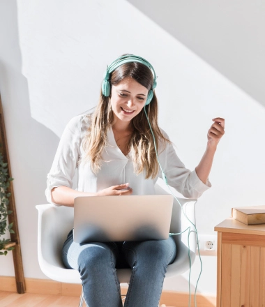 image of a lady working and online music streaming
