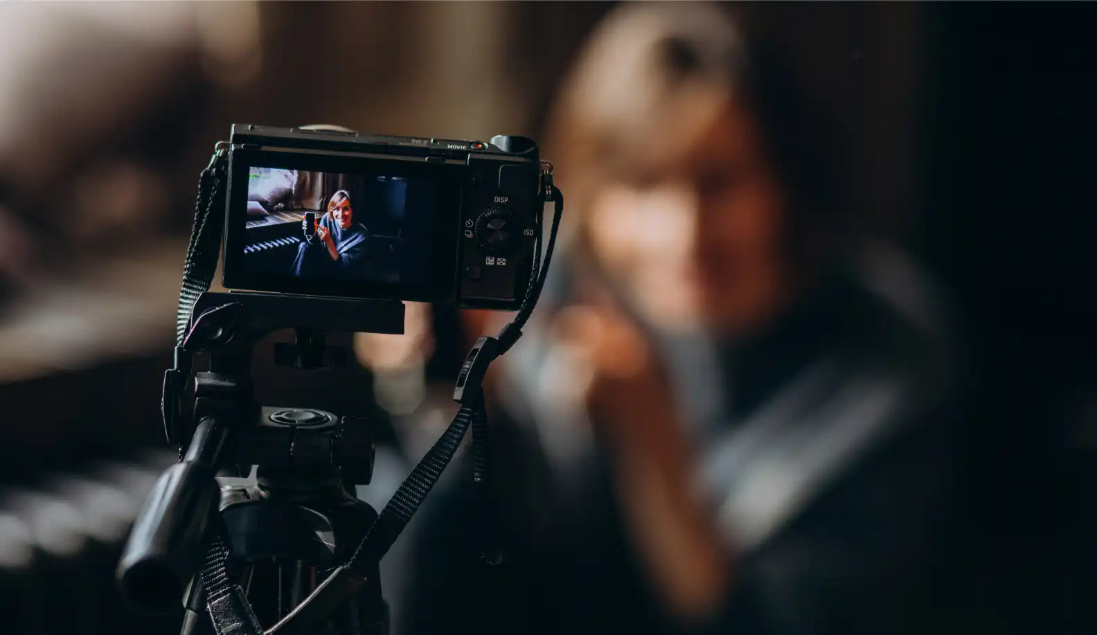image of a lady posing for a photo in front of a camera