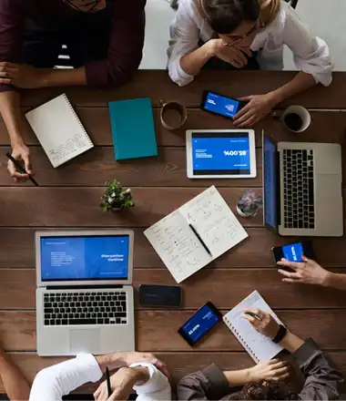 a team of 4 discussing business strategy